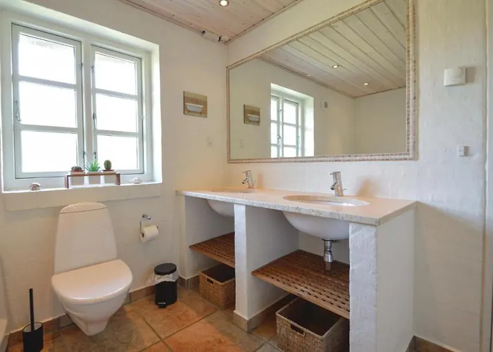 Praestekraven Feriehus Romo